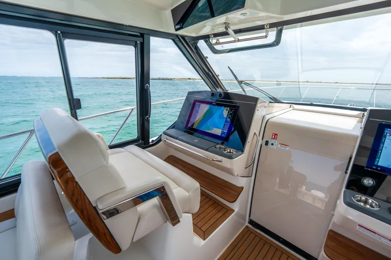 Slide: The Image of Interior of 2026 Boston Whaler 405 Conquest with modern navigation. - 12