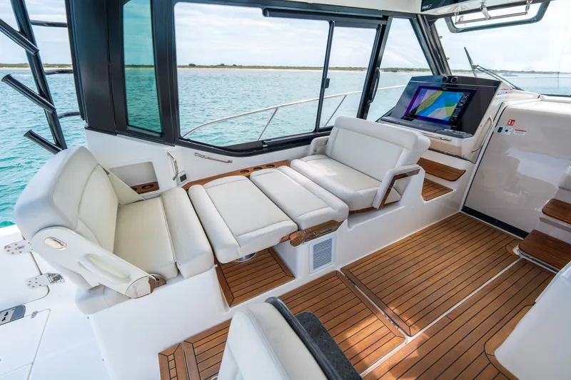 Slide: The Image of Interior of 2026 Boston Whaler 405 Conquest with luxurious seating. - 14