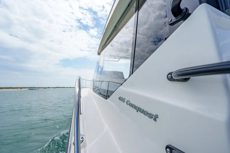 Slide: The Image of Boston Whaler 405 Conquest 2026 on calm waters. - 15