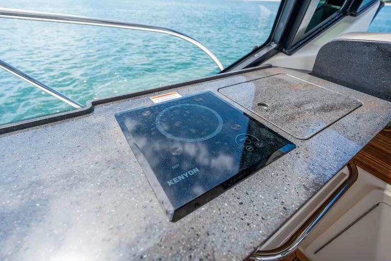 Slide: The Image of Galley on Boston Whaler 405 Conquest 2026 with induction cooktop. - 22