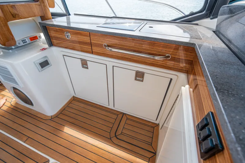Slide: The Image of Interior of 2026 Boston Whaler 405 Conquest with wood finish. - 25