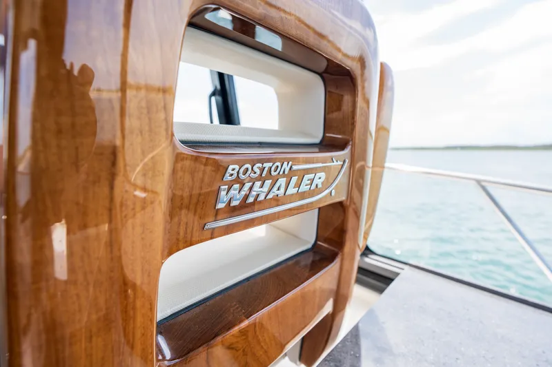Slide: The Image of Close-up of Boston Whaler 405 Conquest 2026 with wood finish. - 26