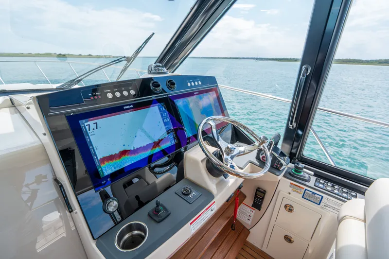 Slide: The Image of Boston Whaler 405 Conquest 2026 helm with advanced navigation systems. - 27