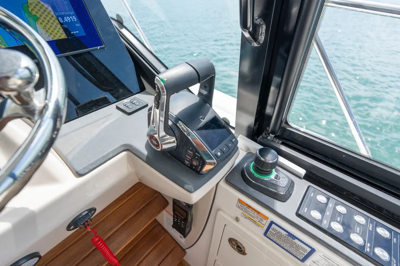 Slide: The Image of Boston Whaler 405 Conquest 2026 helm with controls and display. - 28