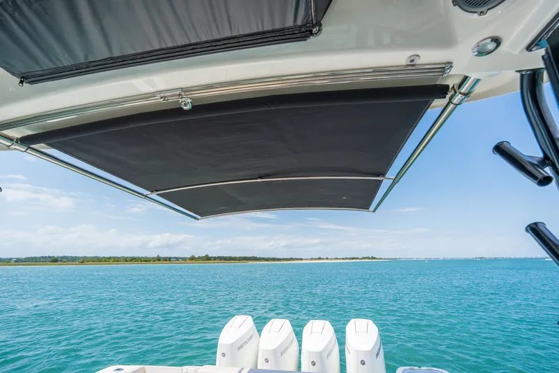 Slide: The Image of Boston Whaler 405 Conquest 2026 with sunshade and ocean view. - 30