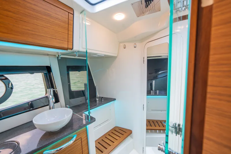 Slide: The Image of Luxurious bathroom in the 2026 Boston Whaler 405 Conquest boat. - 38