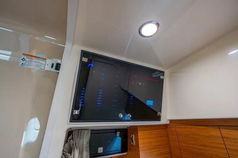 Slide: The Image of Interior view of 2026 Boston Whaler 405 Conquest control panel. - 39