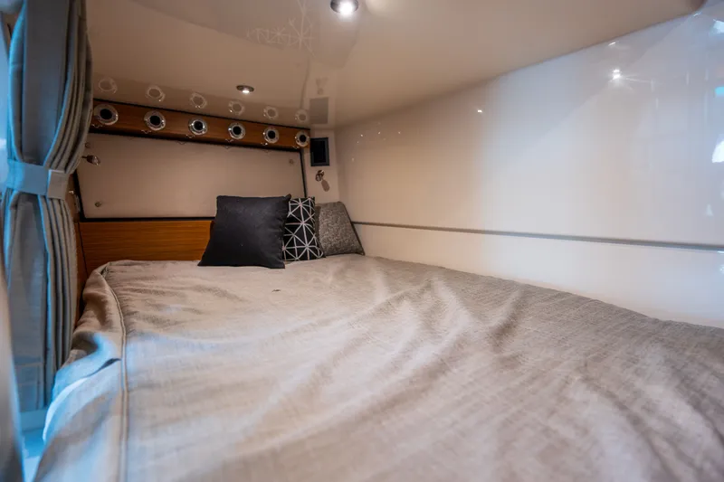 Slide: The Image of Interior of 2026 Boston Whaler 405 Conquest with cozy bed. - 40