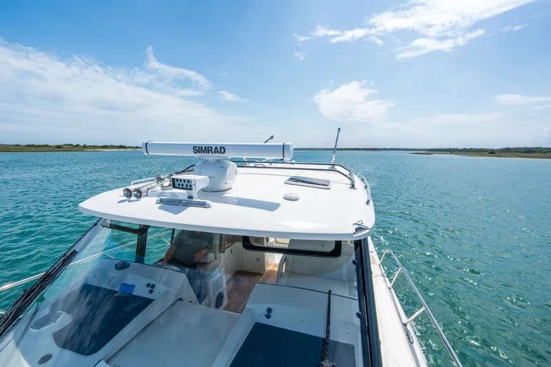 Slide: The Image of Boston Whaler 405 Conquest 2026 on open water under sunny skies. - 45