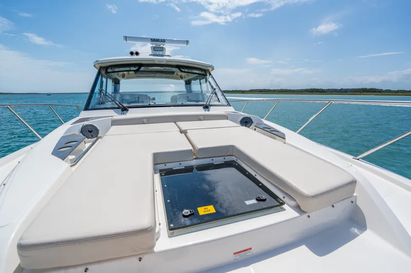 Slide: The Image of Boston Whaler 405 Conquest 2026 on open water under sunny skies. - 46