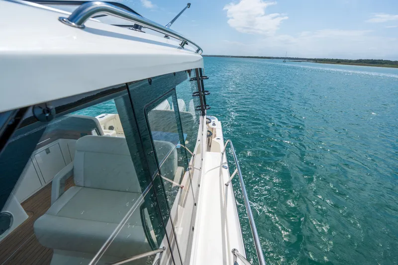 Slide: The Image of Boston Whaler 405 Conquest 2026 on open water under sunny skies. - 49