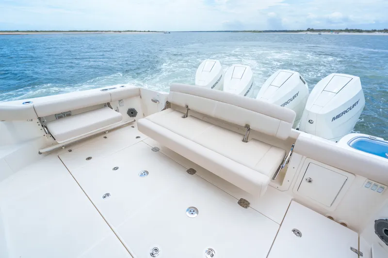 Slide: The Image of Boston Whaler 405 Conquest 2026 with four Mercury engines on open water. - 5