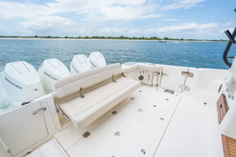 Slide: The Image of Boston Whaler 405 Conquest 2026 with four Mercury engines on open water. - 6