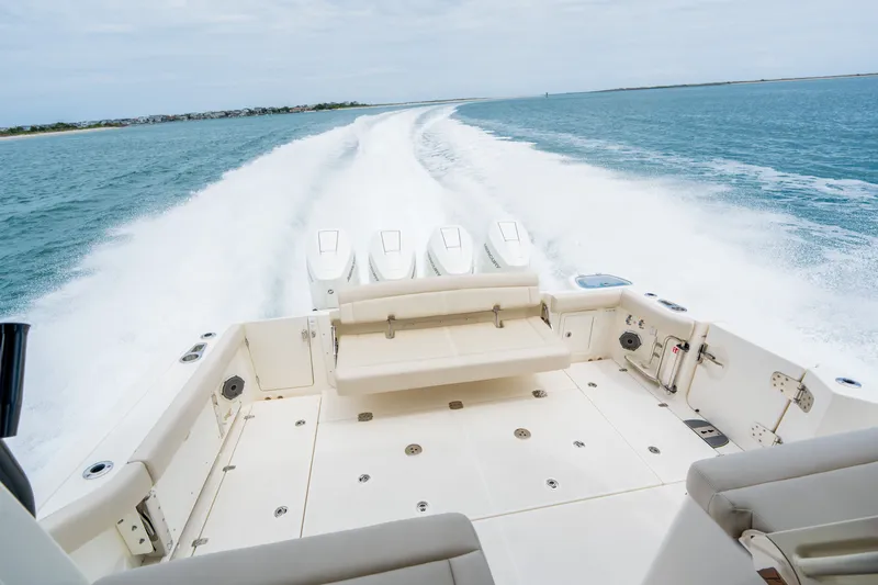 Slide: The Image of Boston Whaler 405 Conquest 2026 cruising with powerful engines on open water. - 7