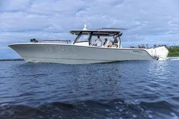 Slide: The Image of 2026 Front Runner 37 Cat boat cruising on open water under a cloudy sky. - 3