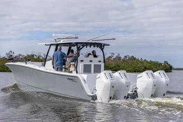 Slide: The Image of 2026 Front Runner 37 Cat boat with four outboard engines cruising on water. - 4