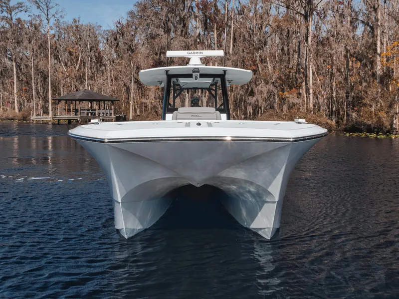 Slide: The Image of Front view of 2026 Front Runner 37 Cat boat on a calm lake. - 7