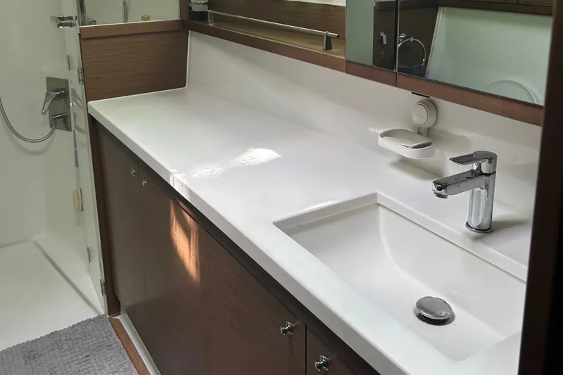 Slide: The Image of Modern bathroom in 2019 Lagoon 450 F Owner's Edition yacht with sleek sink and shower. - 31