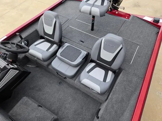 Slide: The Image of 2025 Lowe Stinger 175C boat interior with gray seating and steering console. - 8