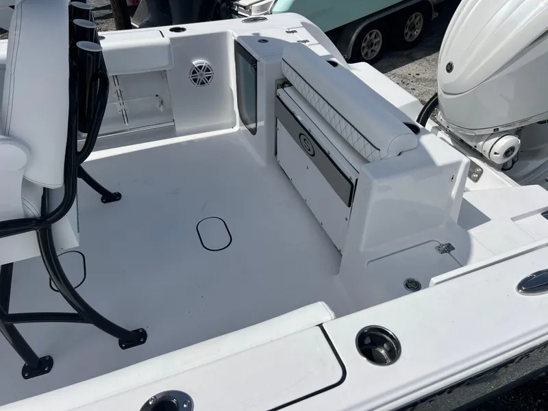 Slide: The Image of 2025 Sportsman Open 232 Center Console boat interior with seating and storage features. - 16