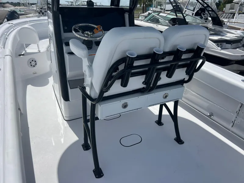 Slide: The Image of 2025 Sportsman Open 232 Center Console boat interior with dual seats and steering console. - 7