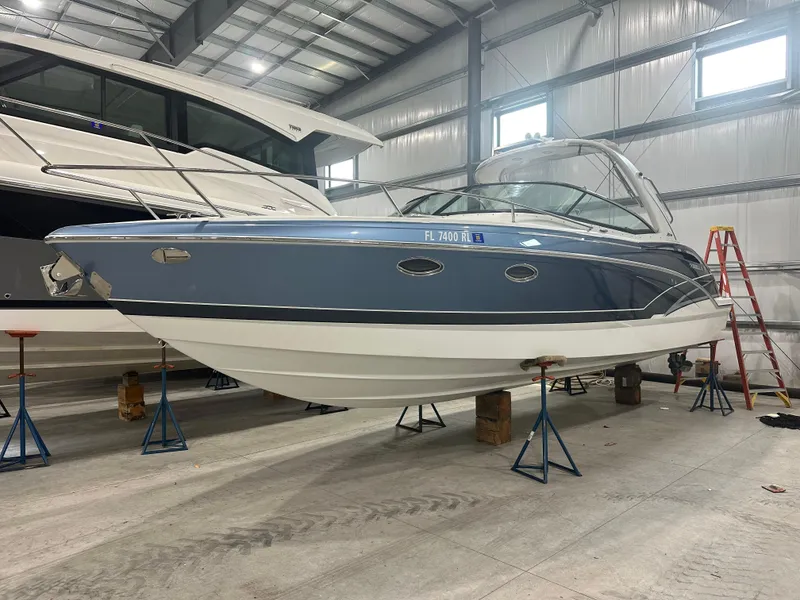 The Image of 2018 Formula 310 Sun Sport boat in indoor storage on stands. - 0