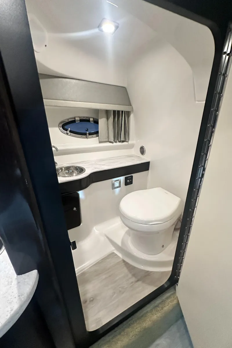 Slide: The Image of 2018 Formula 310 Sun Sport boat bathroom with modern fixtures and compact design. - 14