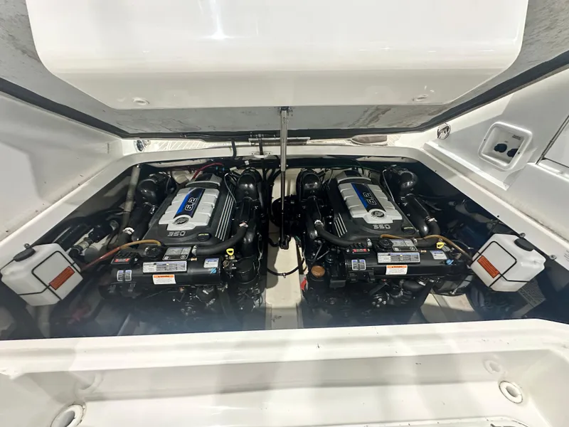 Slide: The Image of Engine compartment of a 2018 Formula 310 Sun Sport boat, featuring dual engines. - 15
