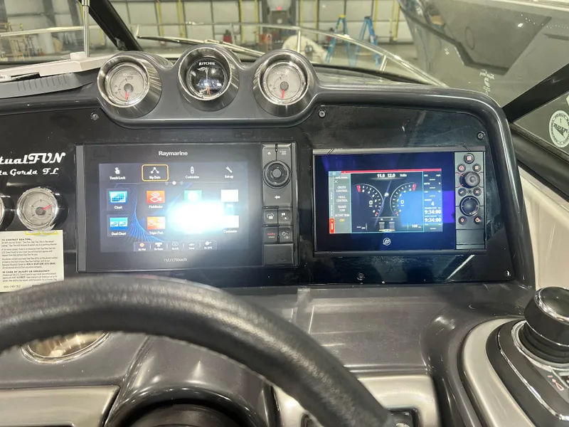 Slide: The Image of Dashboard of a 2018 Formula 310 Sun Sport boat with digital displays and gauges. - 3