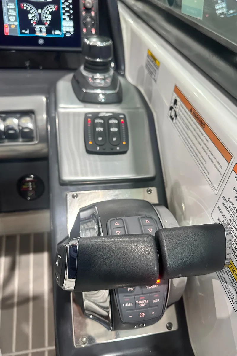 Slide: The Image of Control panel of 2018 Formula 310 Sun Sport boat with throttle and navigation controls. - 4