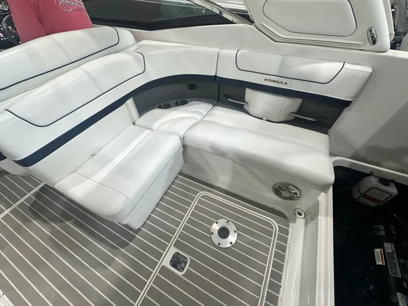 Slide: The Image of 2018 Formula 310 Sun Sport boat interior with white seating and sleek design. - 6