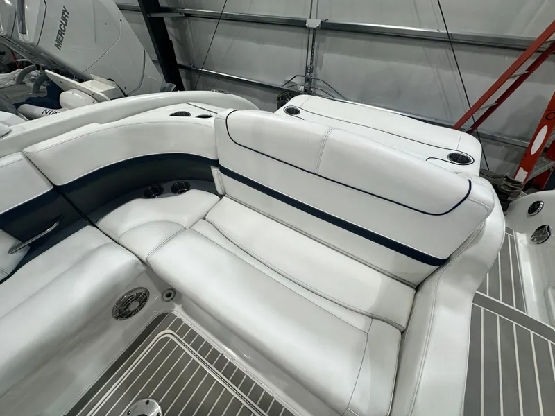 Slide: The Image of 2018 Formula 310 Sun Sport boat interior with white leather seating and cup holders. - 7