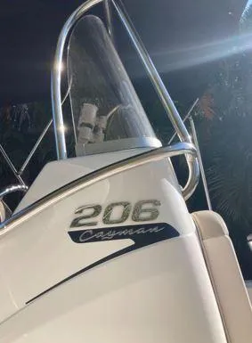 Slide: The Image of 2016 Robalo 206 Cayman boat with sleek design and chrome details. - 3