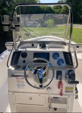 Slide: The Image of 2016 Robalo 206 Cayman boat dashboard with steering wheel and control panel. - 4