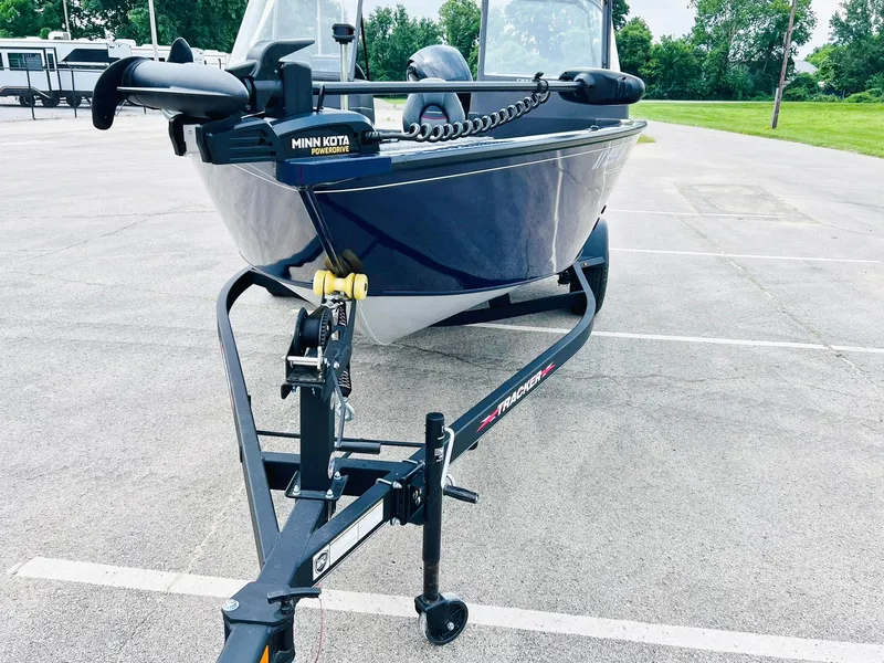 Slide: The Image of 2023 Tracker Pro Guide V-175 WT boat on trailer in parking lot. - 10
