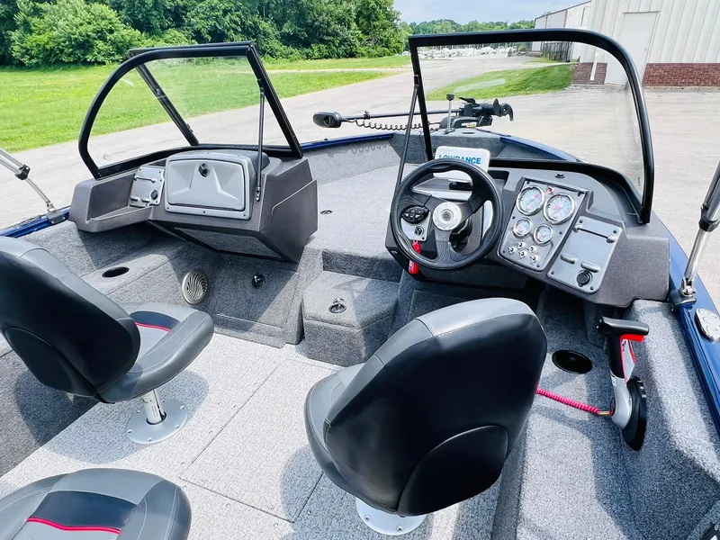 Slide: The Image of 2023 Tracker Pro Guide V-175 WT boat interior with dual seats and control panel. - 11