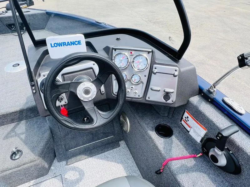 Slide: The Image of 2023 Tracker Pro Guide V-175 WT boat dashboard with steering wheel and Lowrance system. - 13