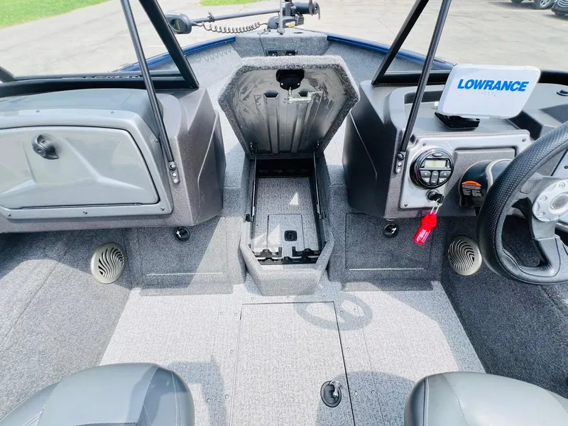 Slide: The Image of 2023 Tracker Pro Guide V-175 WT boat interior with Lowrance system and storage compartments. - 14