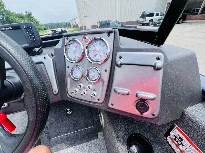 Slide: The Image of Dashboard of 2023 Tracker Pro Guide V-175 WT boat with gauges and controls. - 16