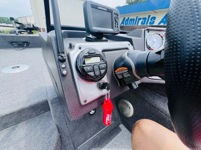 Slide: The Image of 2023 Tracker Pro Guide V-175 WT dashboard with steering wheel, controls, and navigation system. - 17