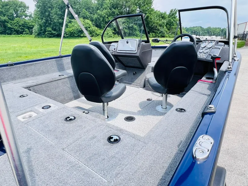 Slide: The Image of 2023 Tracker Pro Guide V-175 WT boat interior with two seats and control panel. - 19