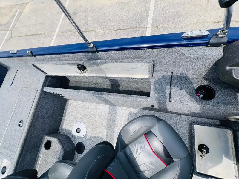 Slide: The Image of 2023 Tracker Pro Guide V-175 WT boat interior with seating and storage compartments. - 25