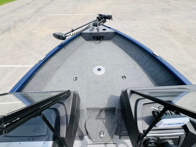 Slide: The Image of 2023 Tracker Pro Guide V-175 WT boat interior with trolling motor, spacious deck, and windshield. - 26
