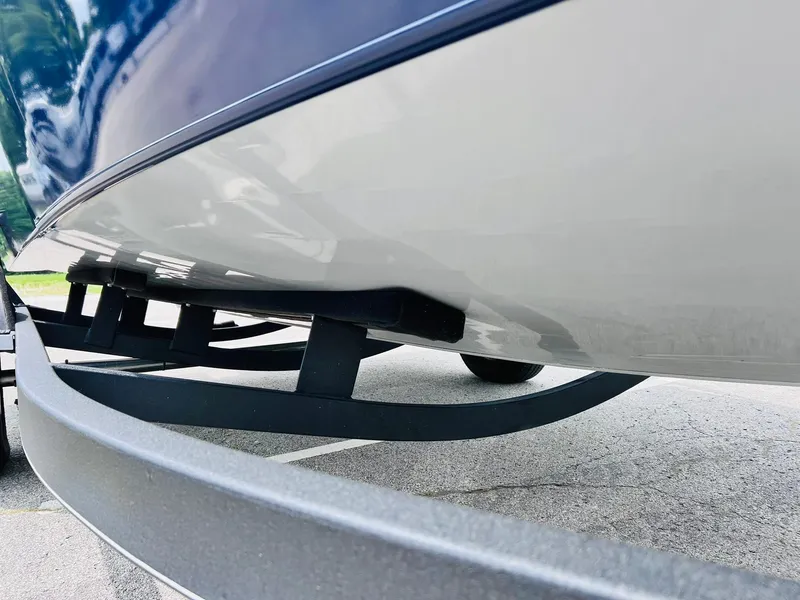 Slide: The Image of 2023 Tracker Pro Guide V-175 WT boat on trailer, close-up view of hull and support. - 39