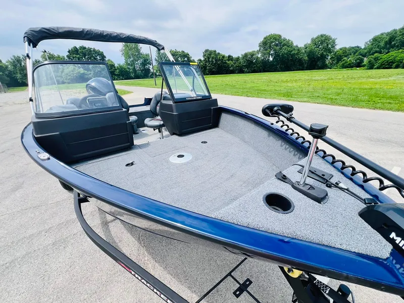 Slide: The Image of 2023 Tracker Pro Guide V-175 WT boat on a trailer, parked on a paved area. - 4