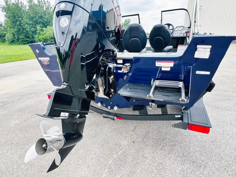 Slide: The Image of 2023 Tracker Pro Guide V-175 WT boat rear view with motor and seating. - 9