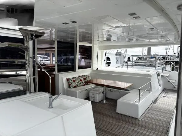 Slide: The Image of Spacious deck of 2012 Lagoon 560 yacht with seating and dining area. - 1