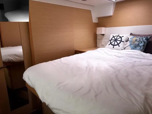 Slide: The Image of Luxurious cabin interior of 2012 Lagoon 560 yacht with cozy bedding and nautical decor. - 10