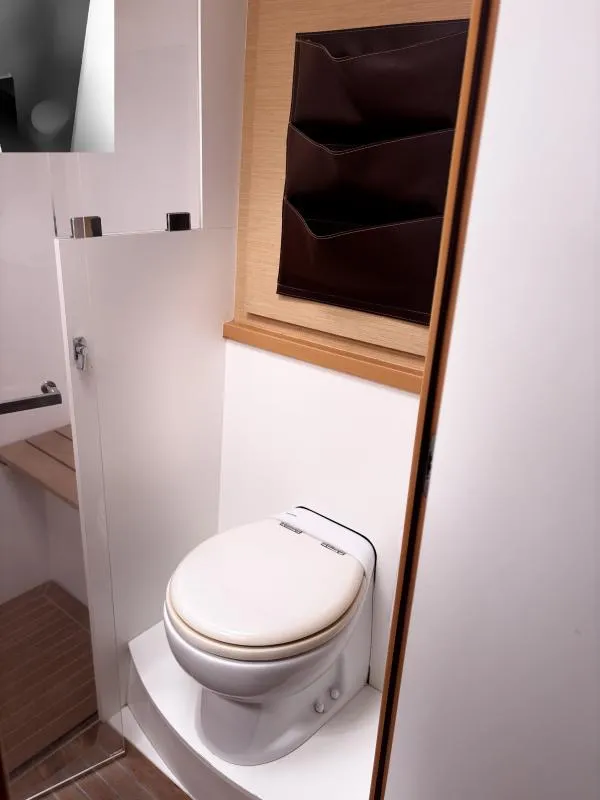 Slide: The Image of Modern bathroom in 2012 Lagoon 560 yacht with sleek design and compact toilet. - 14