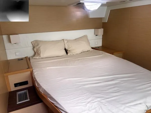 Slide: The Image of Luxurious bedroom interior of 2012 Lagoon 560 yacht with cozy bedding. - 15
